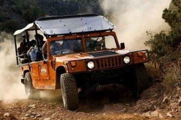 hummer driving on an off road trail