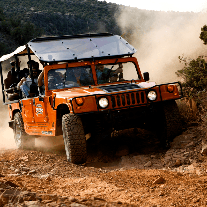 hummer driving on off road trail